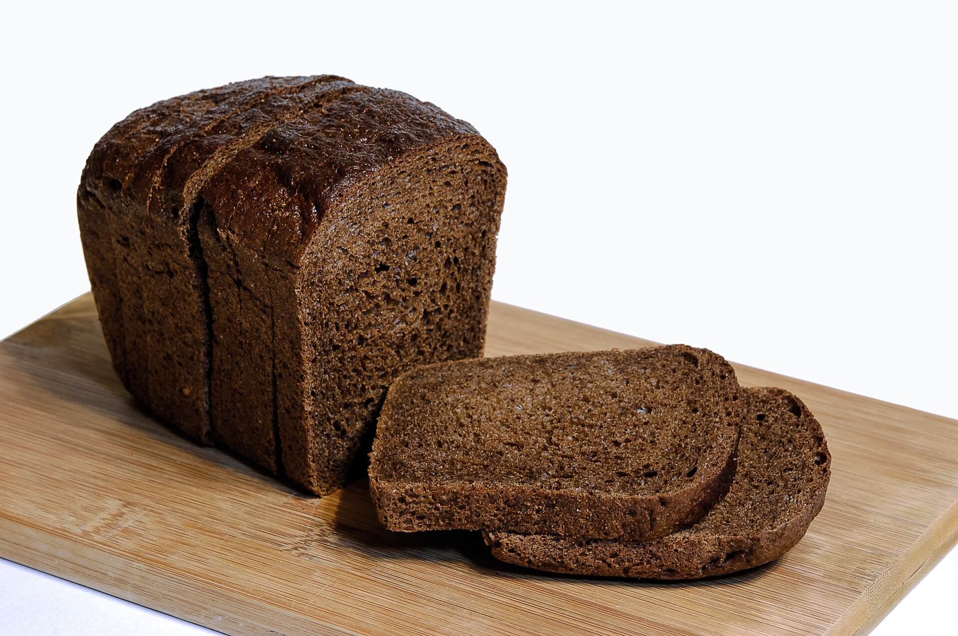 Dark brown small loaf of bread.